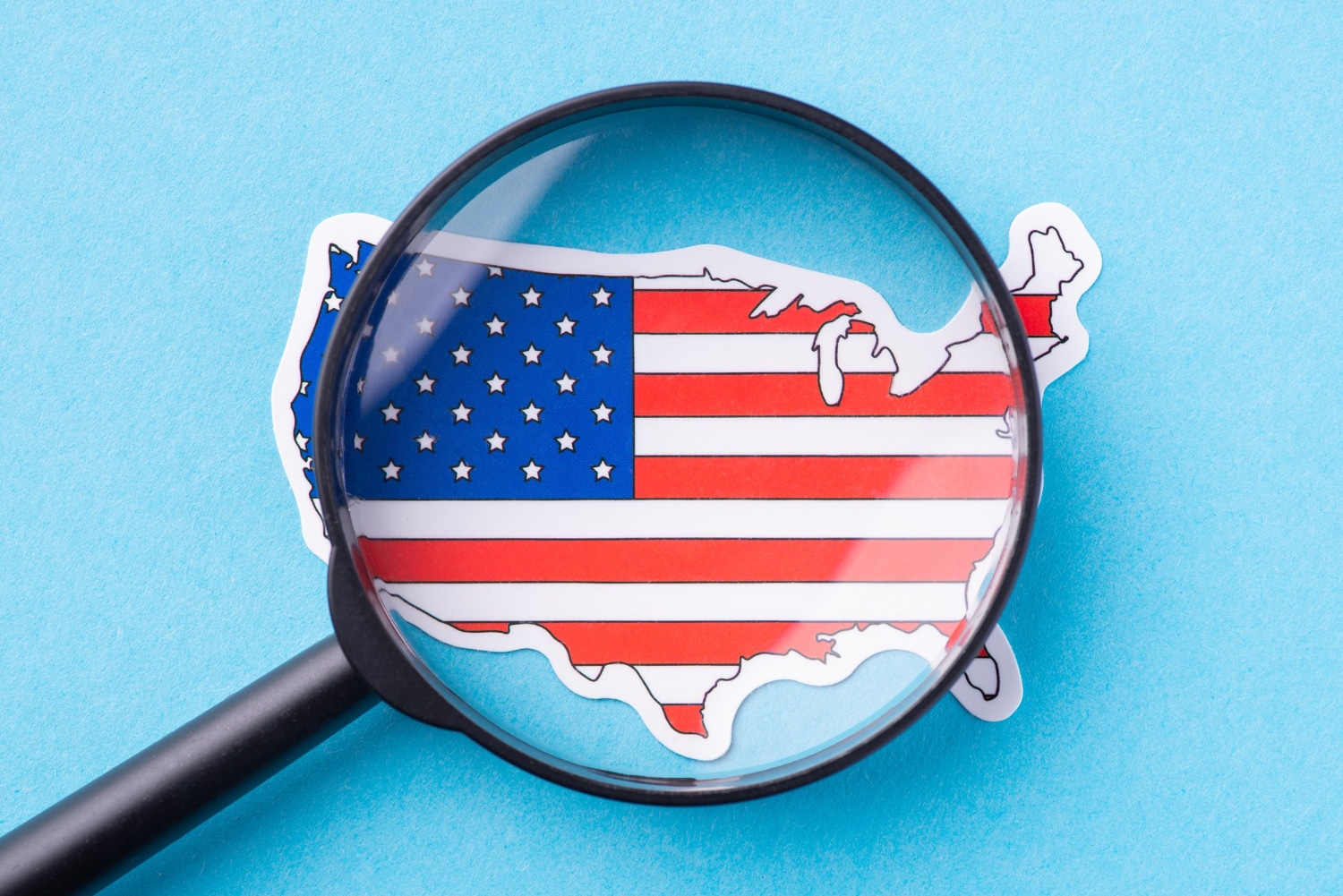 Magnifying Glass Over US Map With American Flag Design