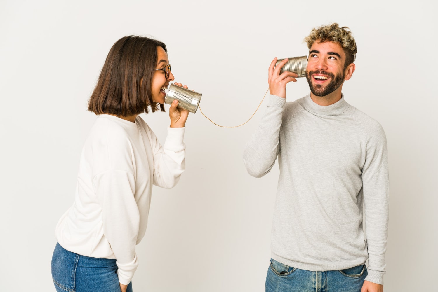 Two People Communicating With Tin Can Telephone
