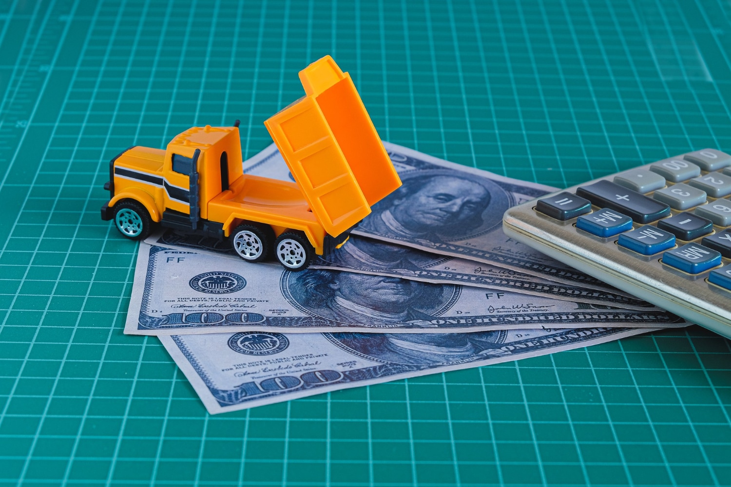 Toy Dump Truck Unloading American Dollar Bills